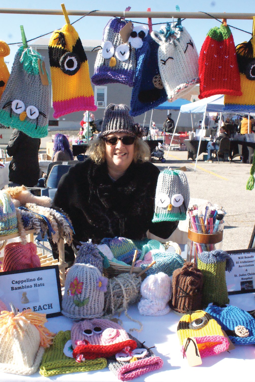 HAT’S OFF TO YOU: Showing off her original designs at the St. Mary’s Feast Society Ladies’ Auxiliary event was Jodi DiRaimo of Cappelino de Bambino Hats.